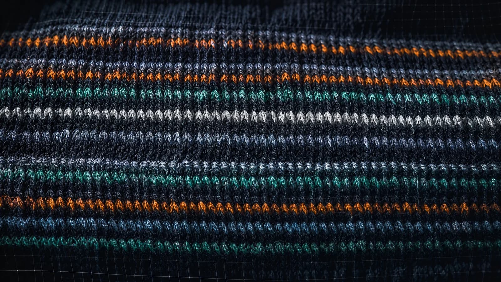 The same ribbed knit pulled wide open horizontally, the ribs flattened out.